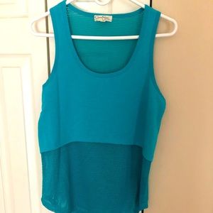 Mesh top with sold overlay